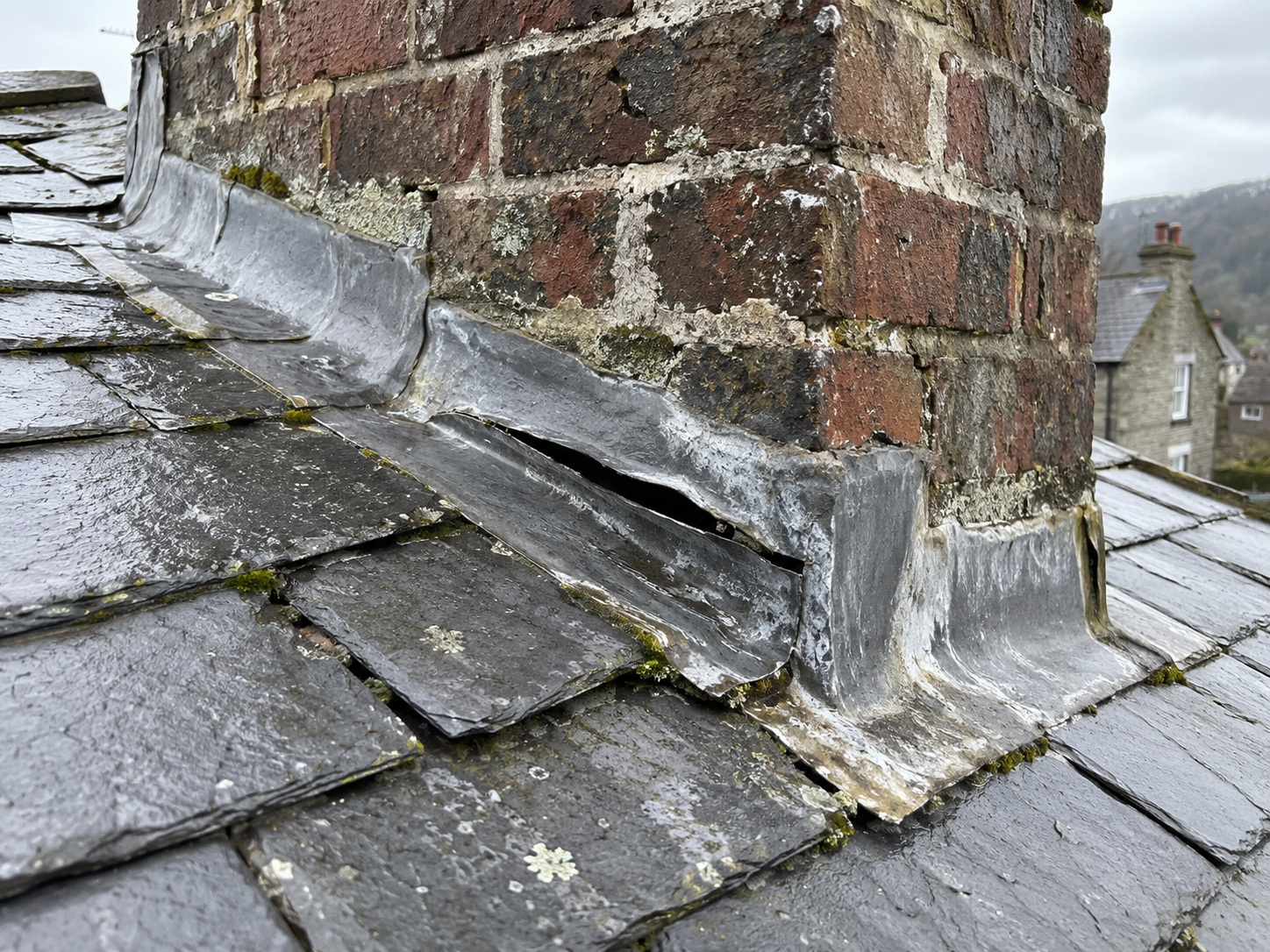 Example customer photo of damaged chimney flashing